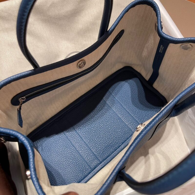fb638e_f41879a7801249a8a98f6233567e1fb8mv2-800x800-1 Replica Hermes Garden Party 30cm Ocean Blue - Image 7